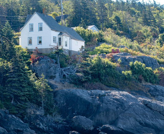 White house on oceanfront slope