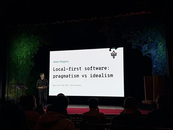Adam Wiggins presents on stage

The slide says

Local-first software: pragmatism vs idealism